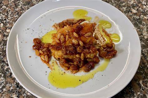 Impiattamento raffinato di un piatto tipico italiano