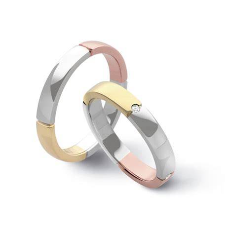 Esempi di diverse fedi nuziali in oro bianco, giallo e rosa